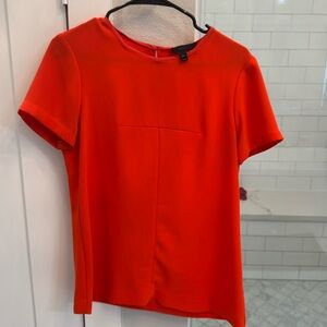 Simple, orange J Crew top with short sleeves